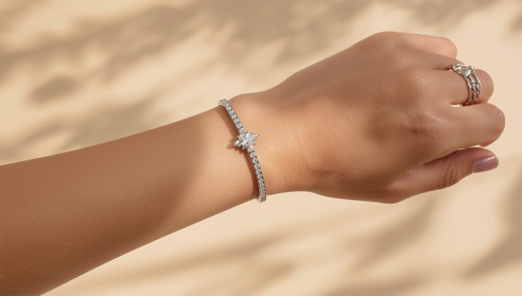 Elegant white gold diamond bracelet worn on wrist in soft lighting